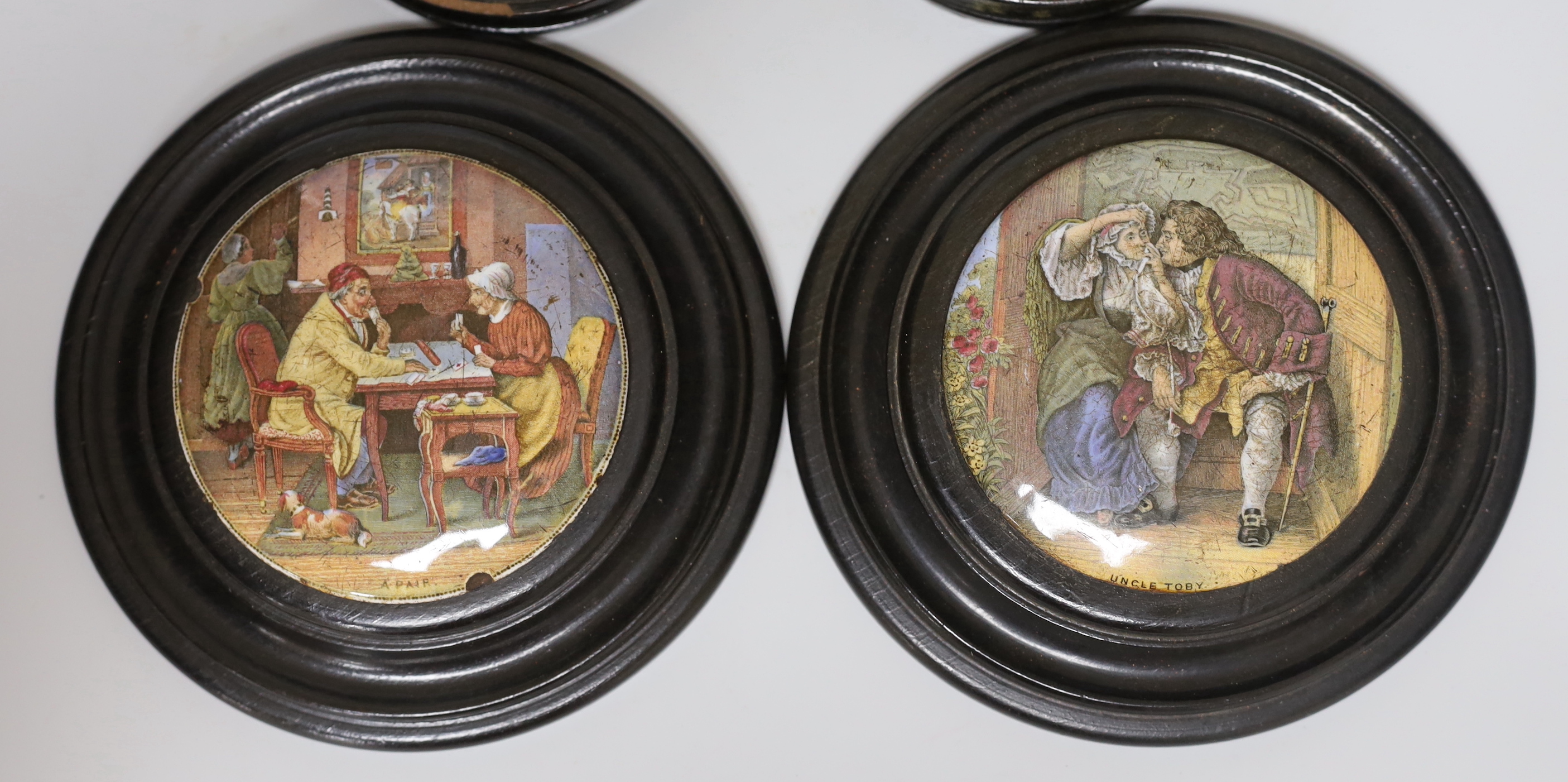 Two Victorian framed pot lids and a pair of framed portrait prints